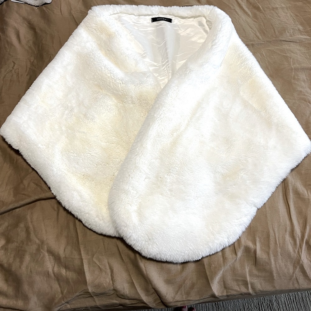 Faux fur - Soft and lovely off-white wrap with three hook closure.